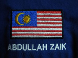 sulam logo bendera kemeja korporat