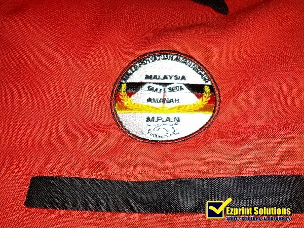 sulam logo baju