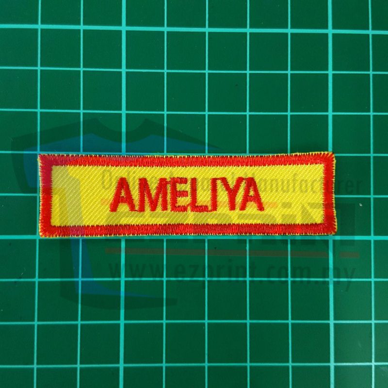 name tag embroidery yellow red